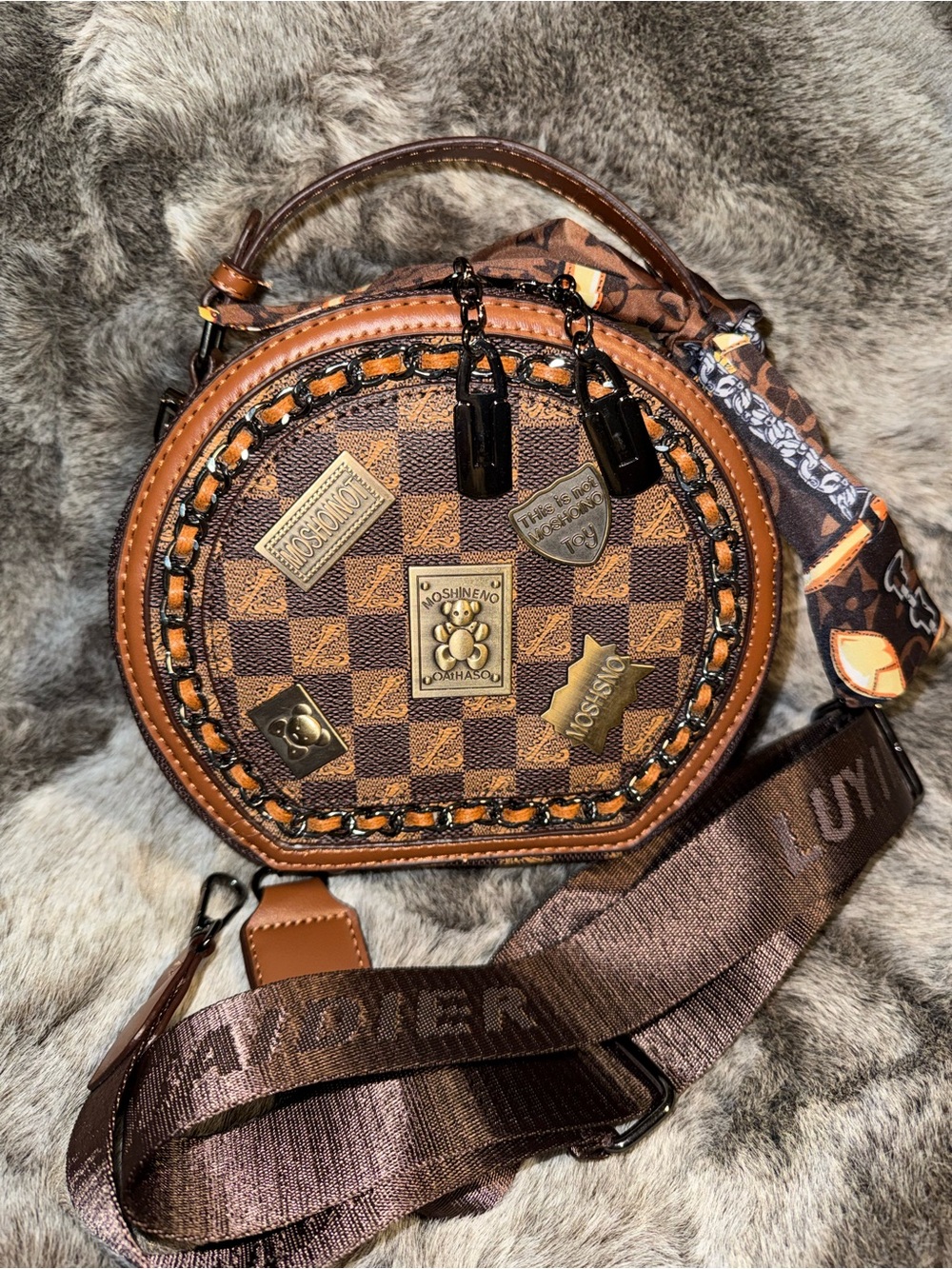 Round Brown Checkerboard Crossbody Bag with Decorative Plaques